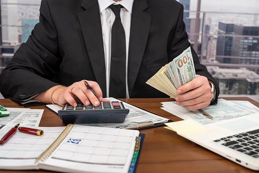 a man working with calculator
